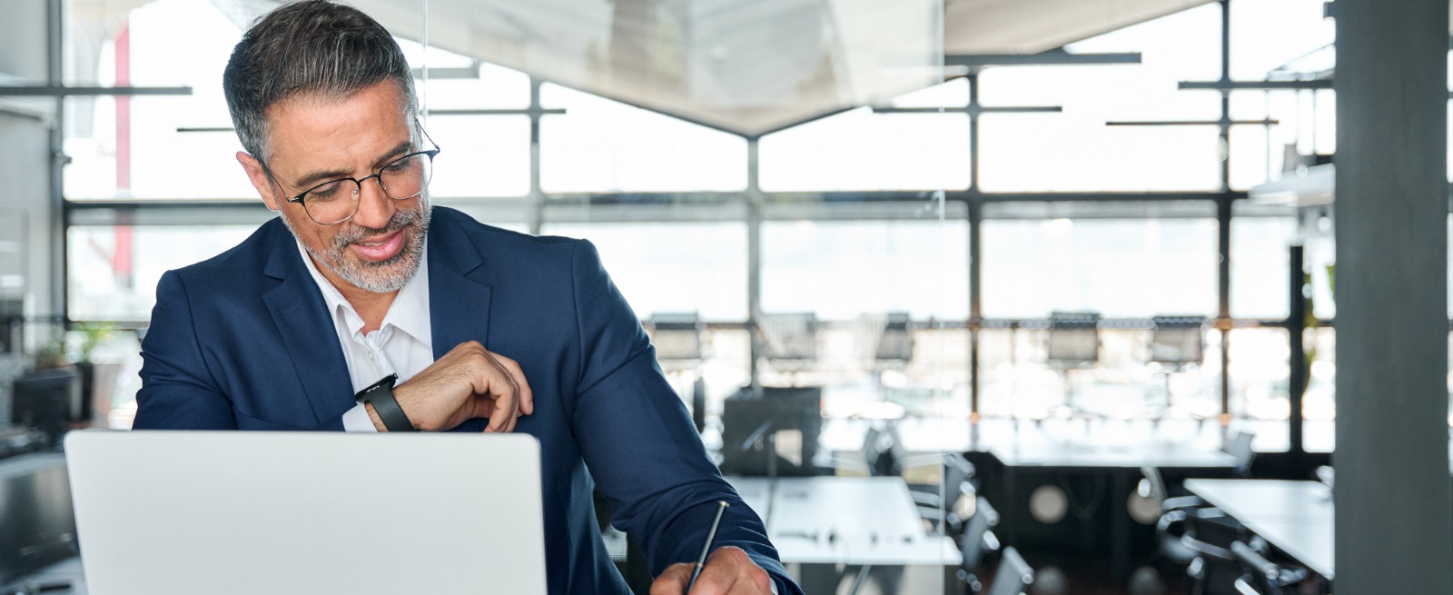 Businessman sitting at a desk working on his computer