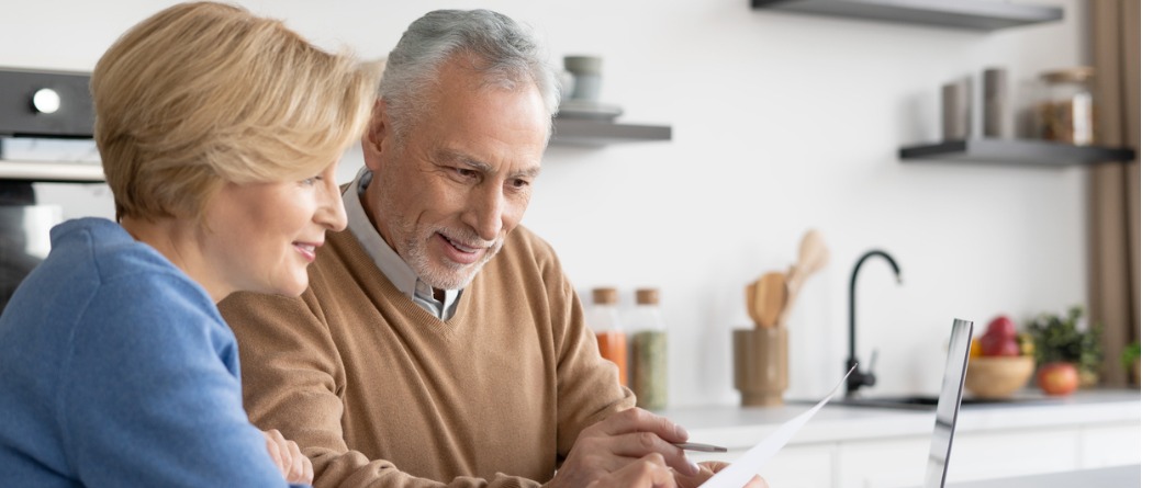 a couple looking at their accounts