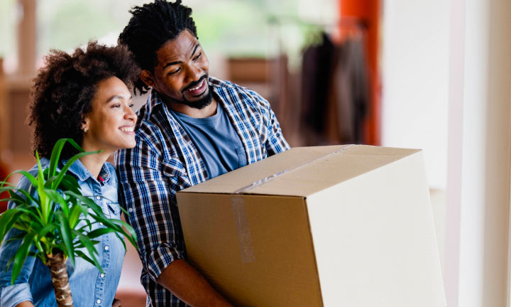 Young couple moving in to new house