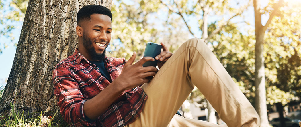 College student using phone on campus